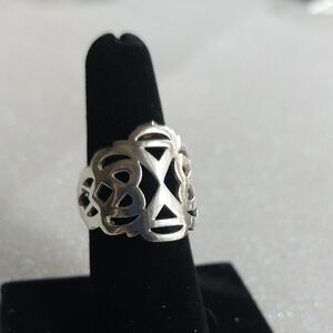 Elle 925 SS Ring. Open Cut w/ Signature Ruby Marking. Size 7